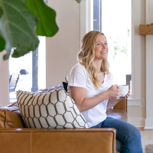 Woman drinking Ancient Nutrition collagen protein